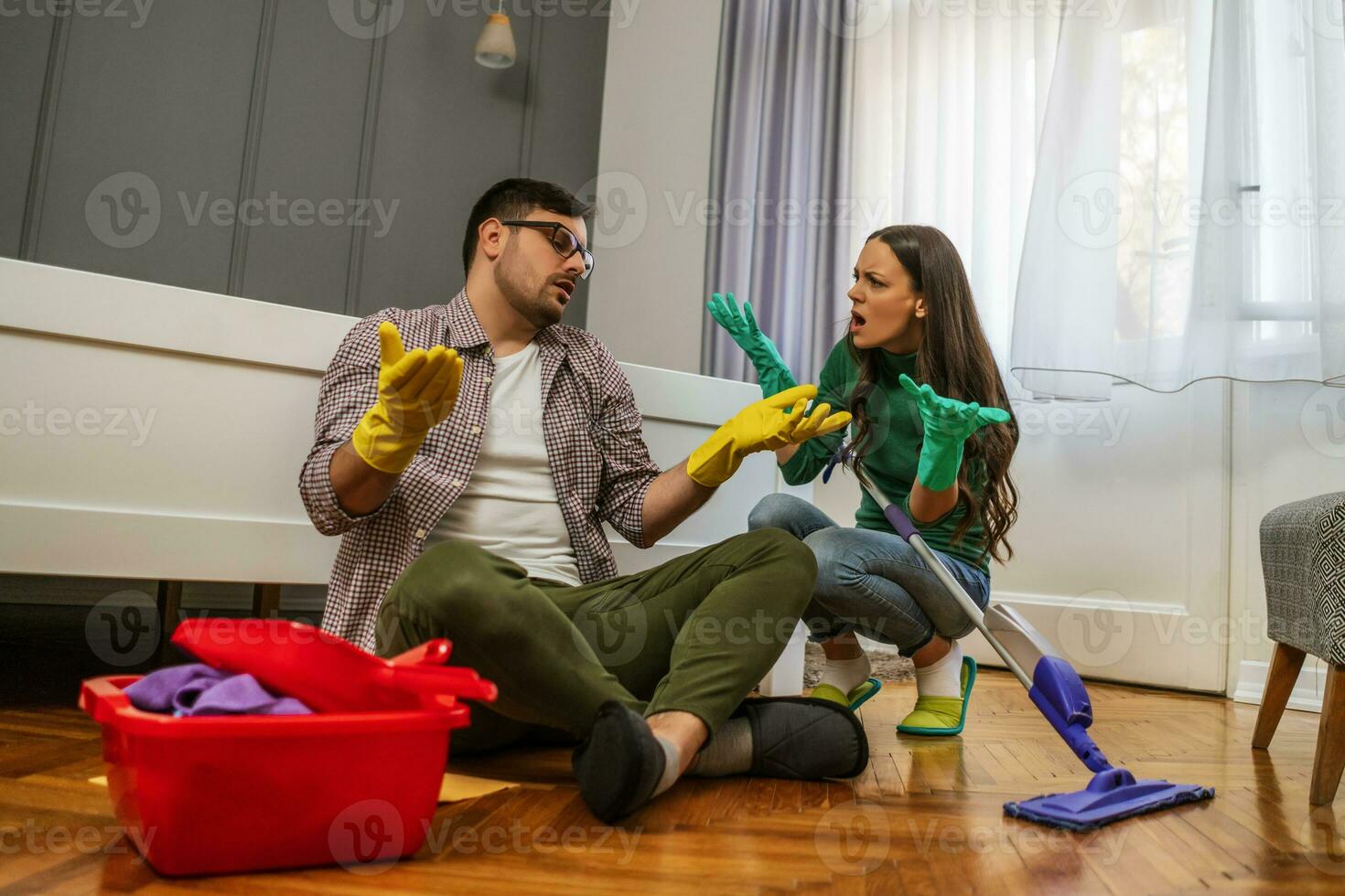 Young couple is cleaning their apartment photo