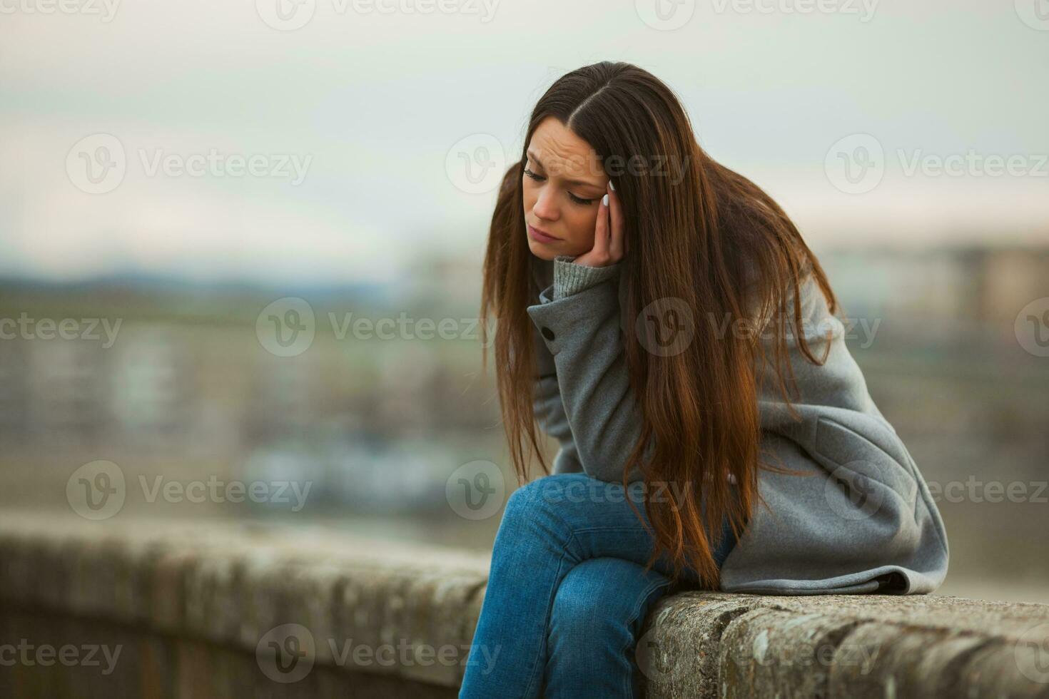 A woman spending time outside, in the city photo