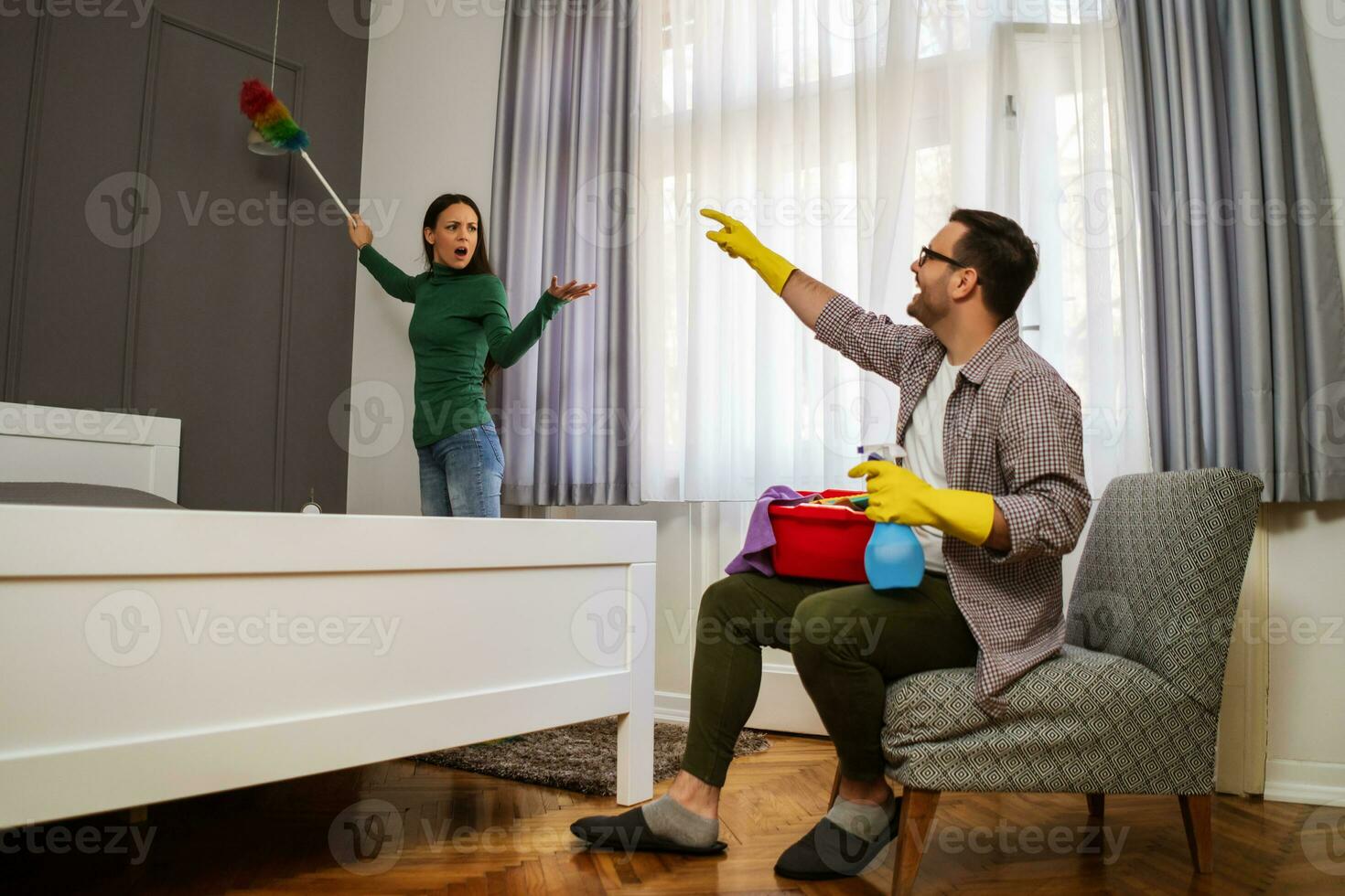 Young couple is cleaning their apartment photo