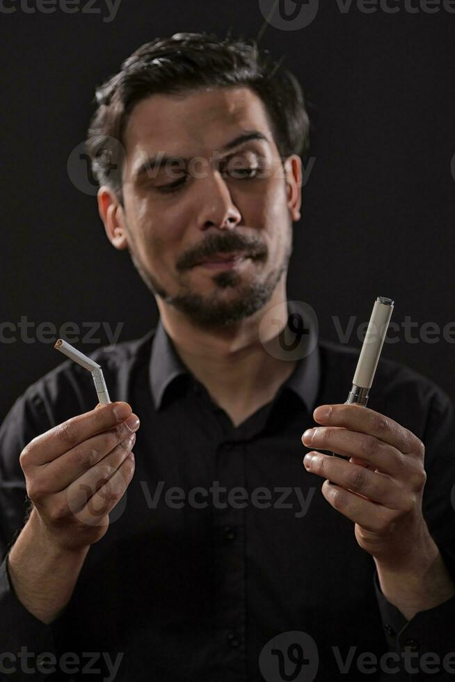 A man who is going to decide which cigarette he will smoke photo