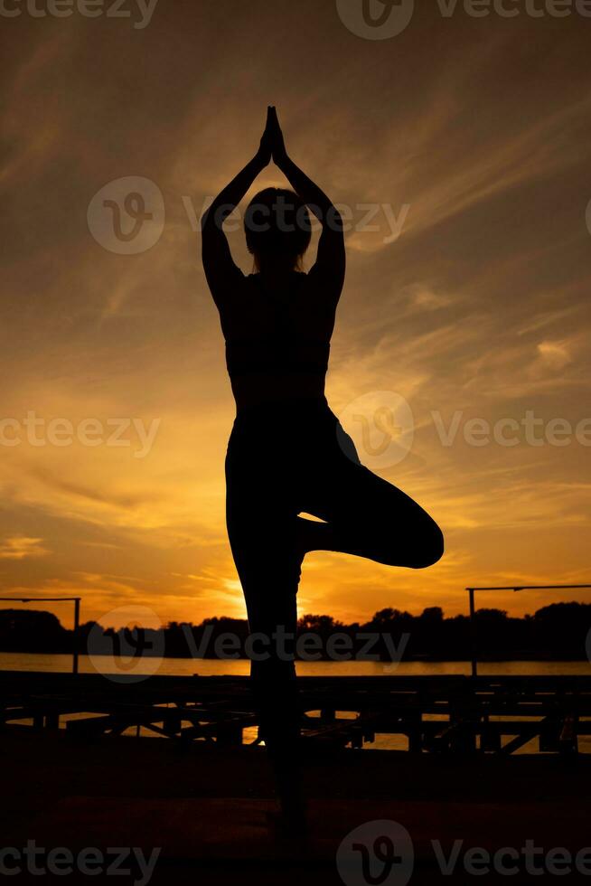 A woman doing physical exercises photo