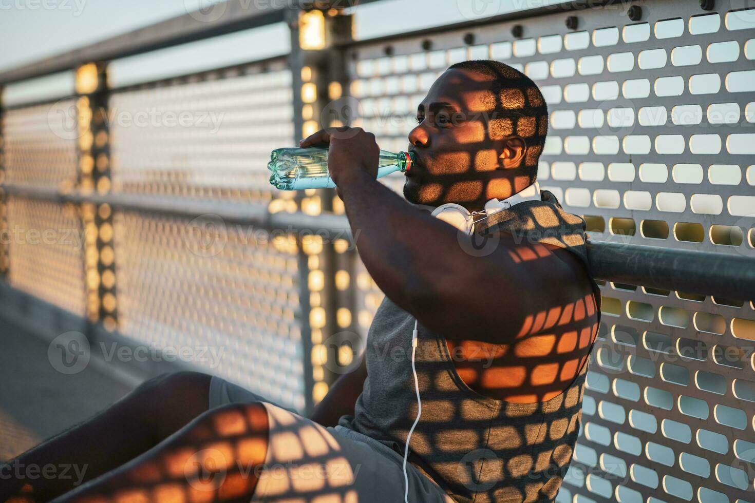 An African American man drinking water photo