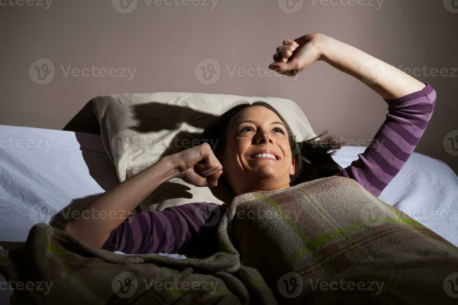 A young woman resting in the bed photo