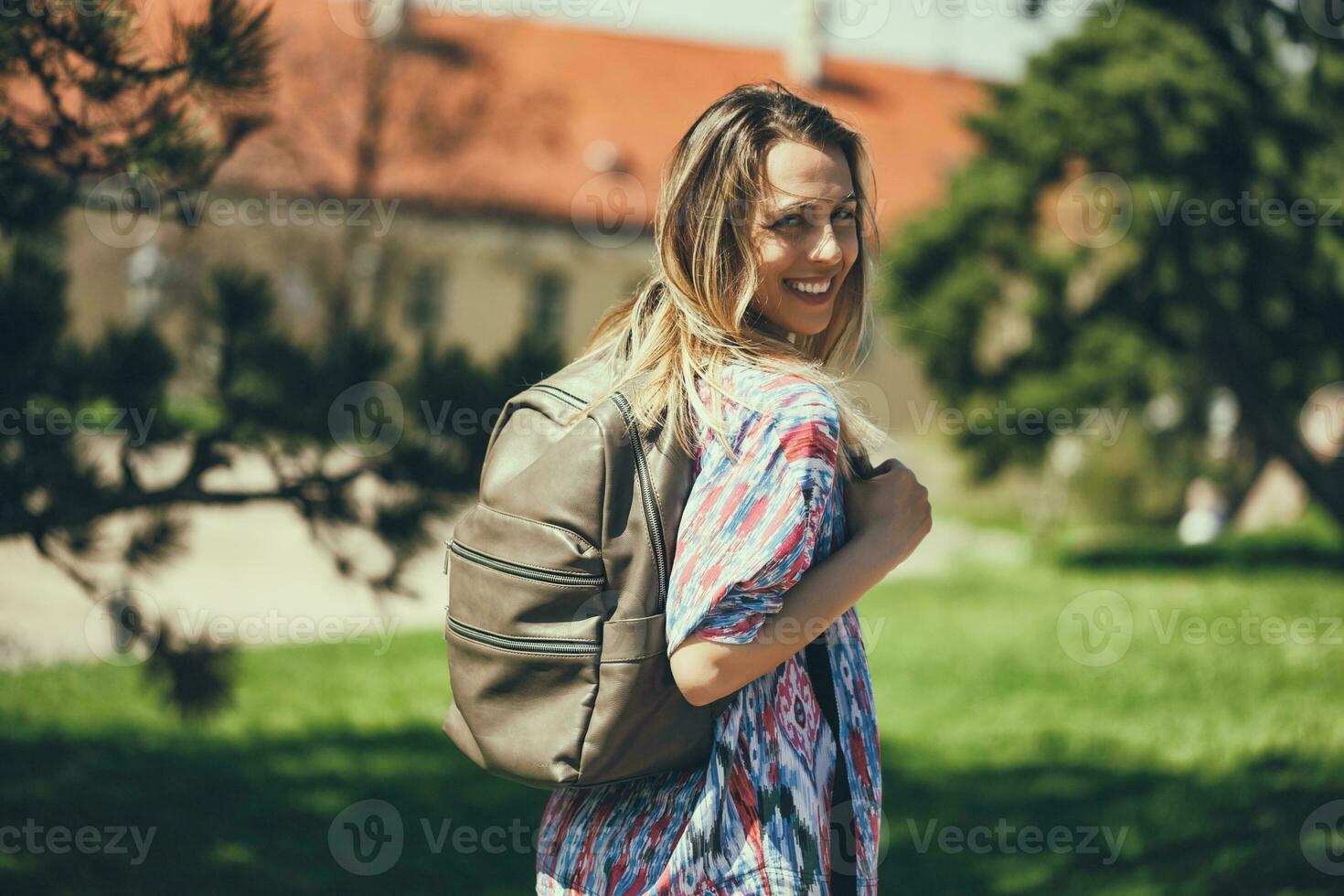 Young tourist woman on the park photo
