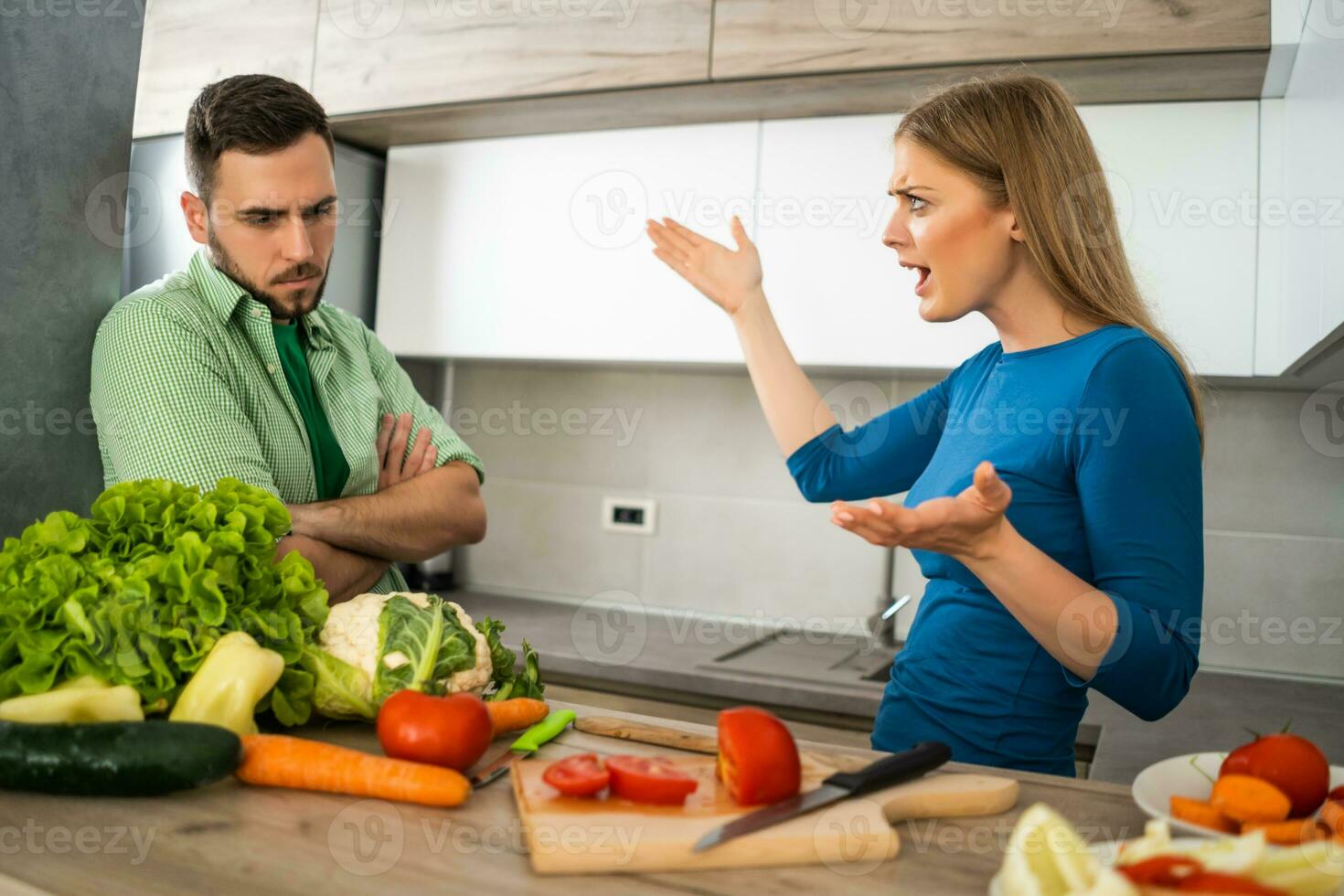 A young couple cooking together photo