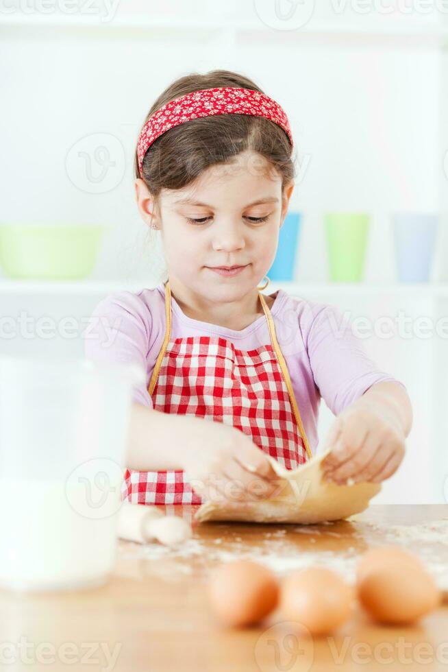 A young girl cooking photo