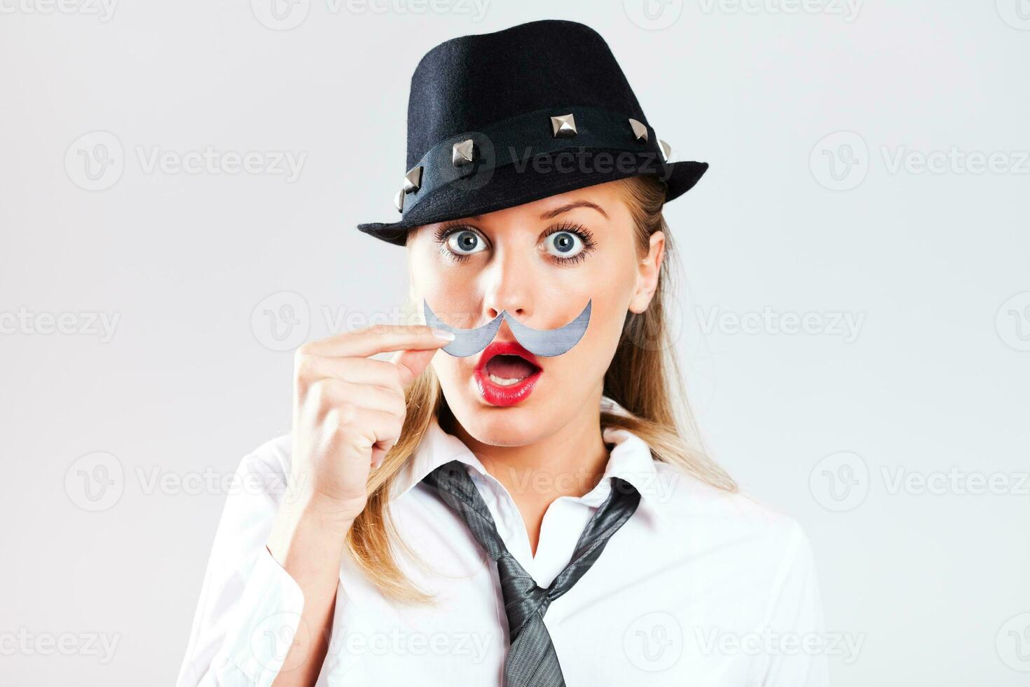 Portrait of a woman with a paper mustache photo