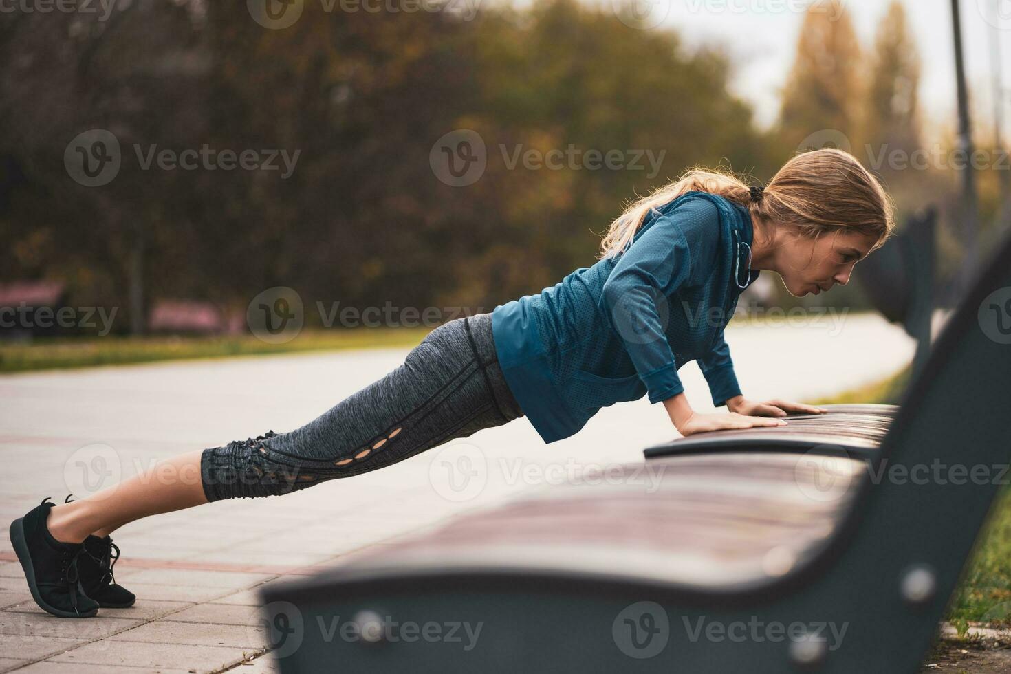 A young woman doing physical exercises photo