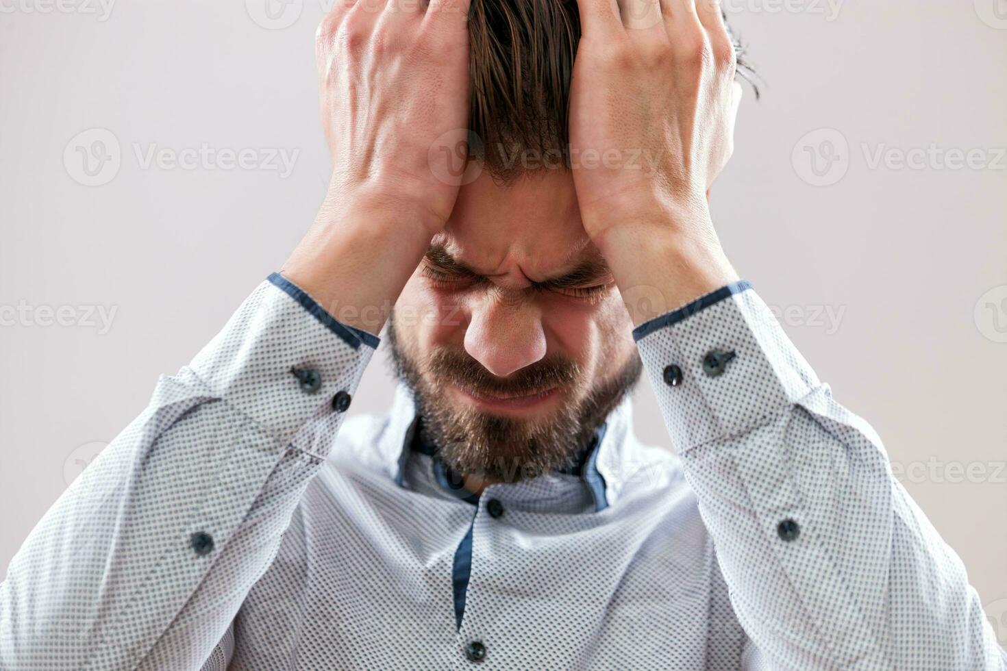 A man in a gray shirt photo