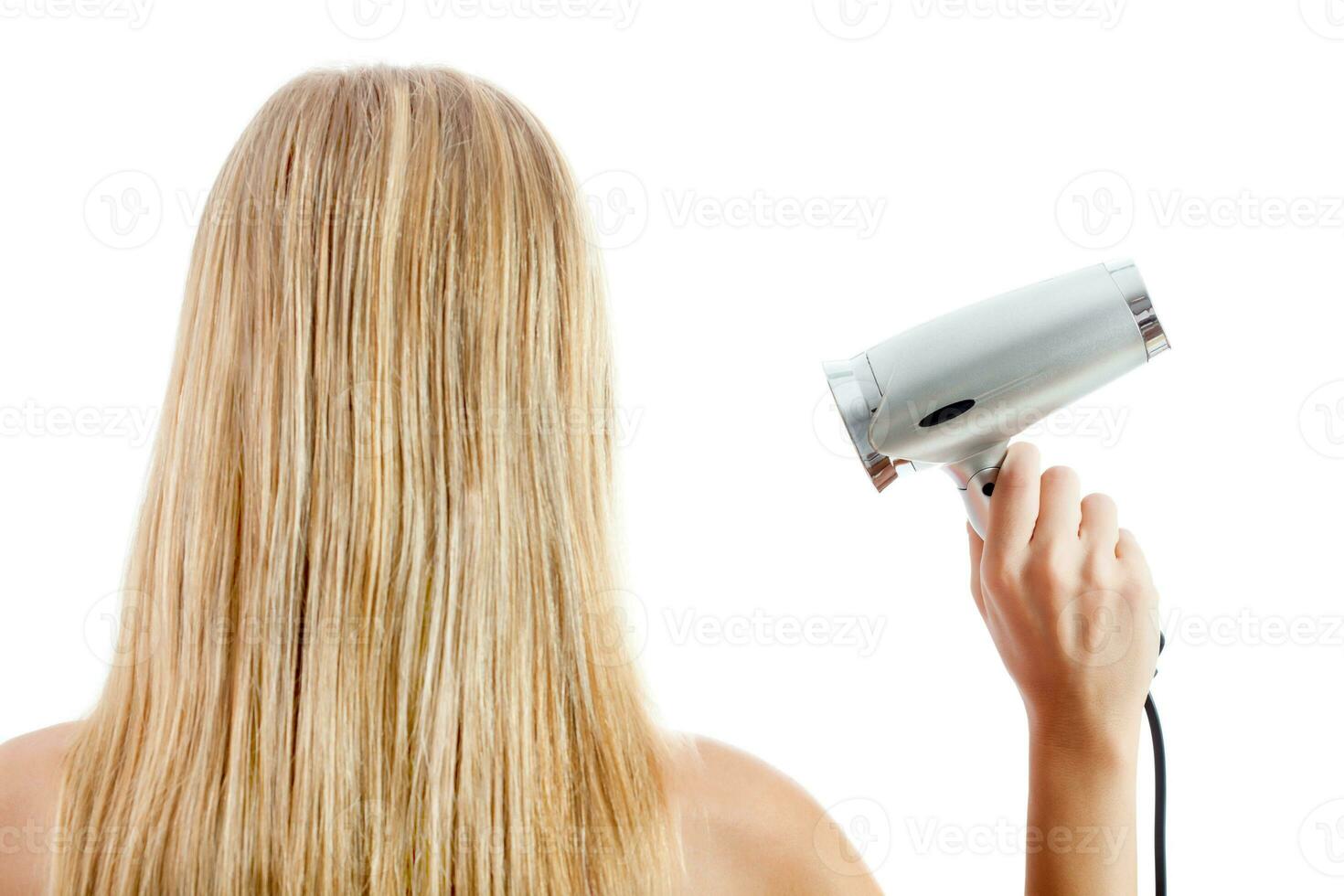 A woman taking care of her hair photo