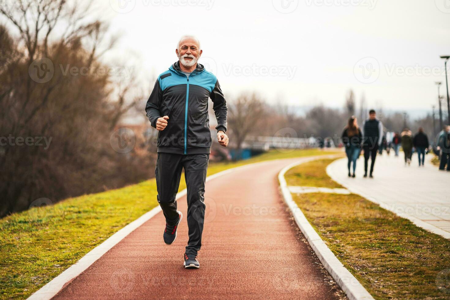 A senior man doing physical exercises photo