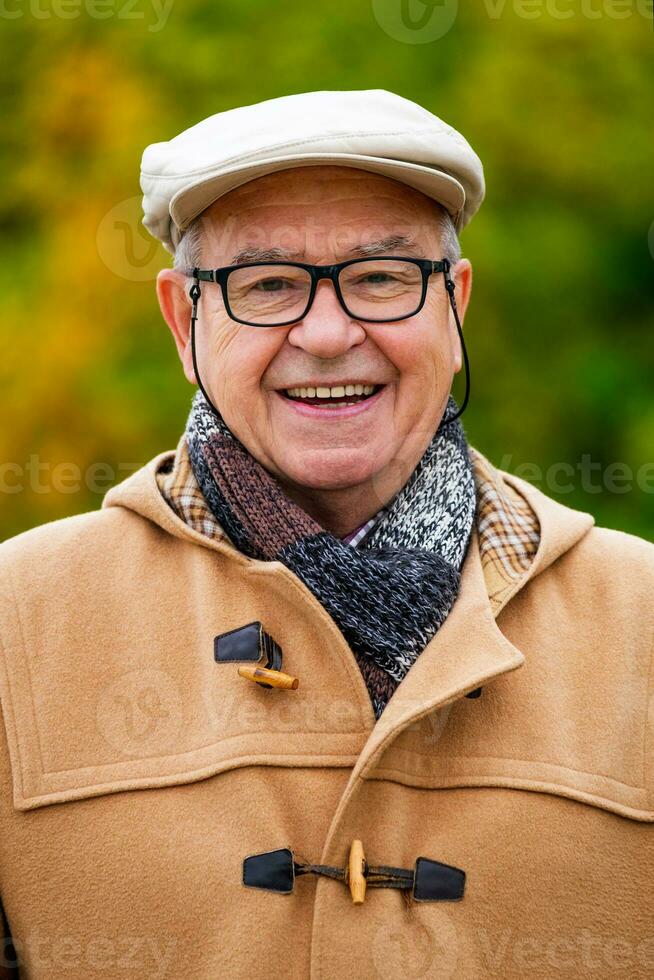 Outdoor portrait of a senior man in winter coat photo