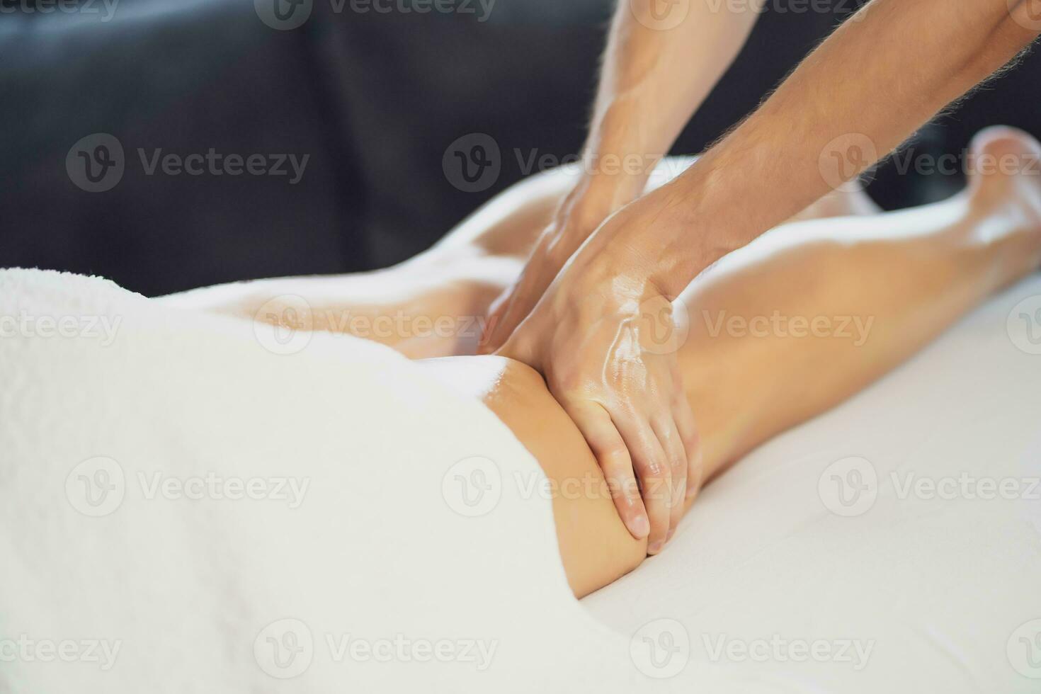 Woman enjoying a leg massage photo