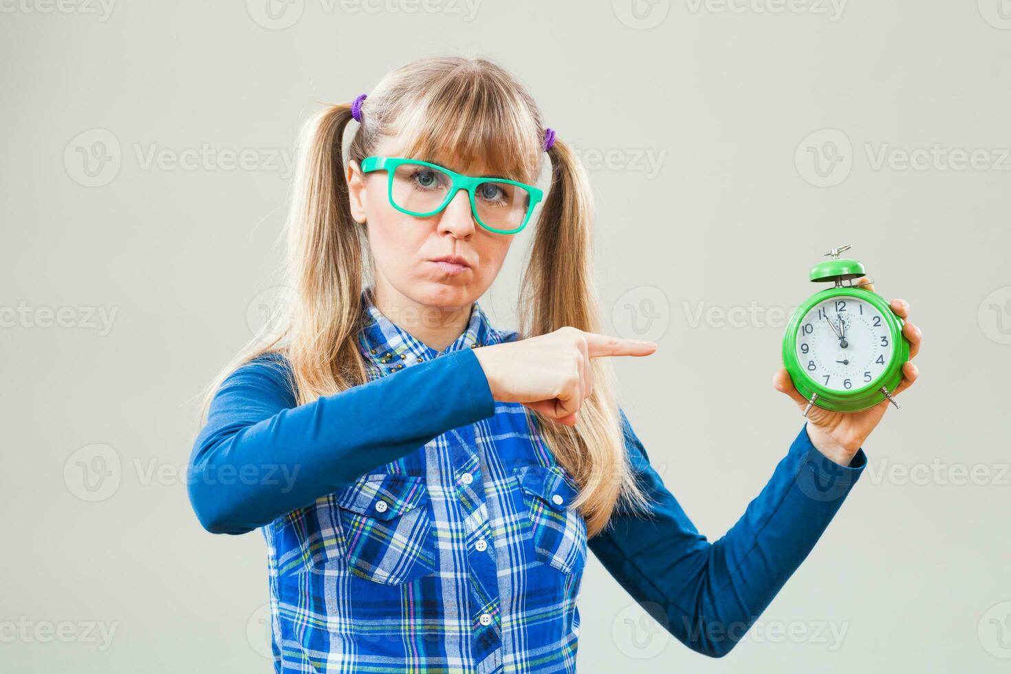 Portrait of a woman with green glasses and a clock photo