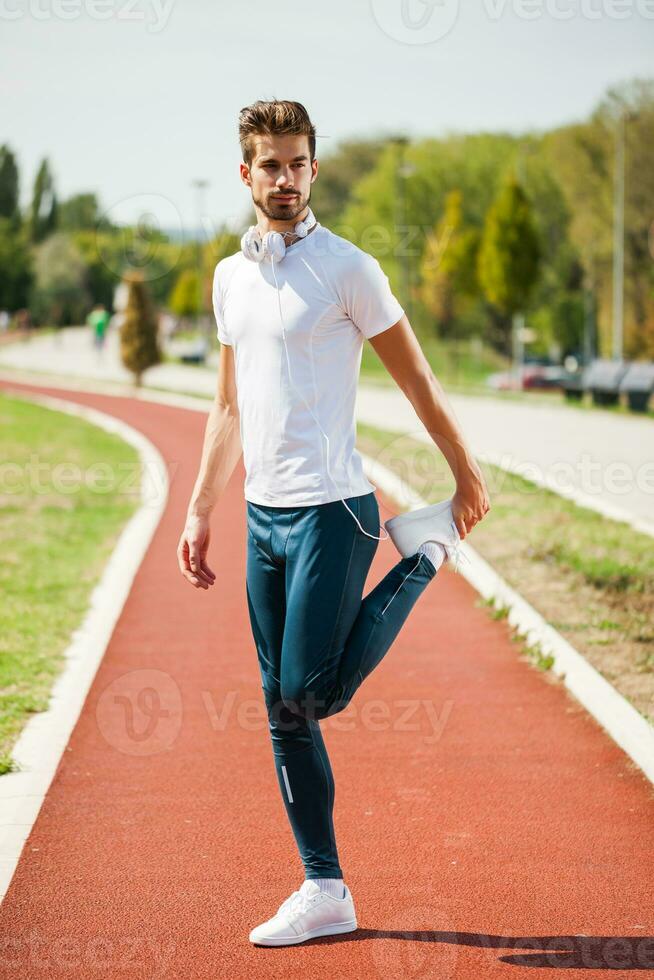 A man on a running track photo