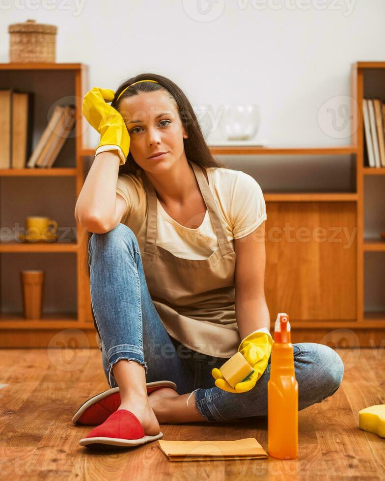 A woman cleaning the house photo