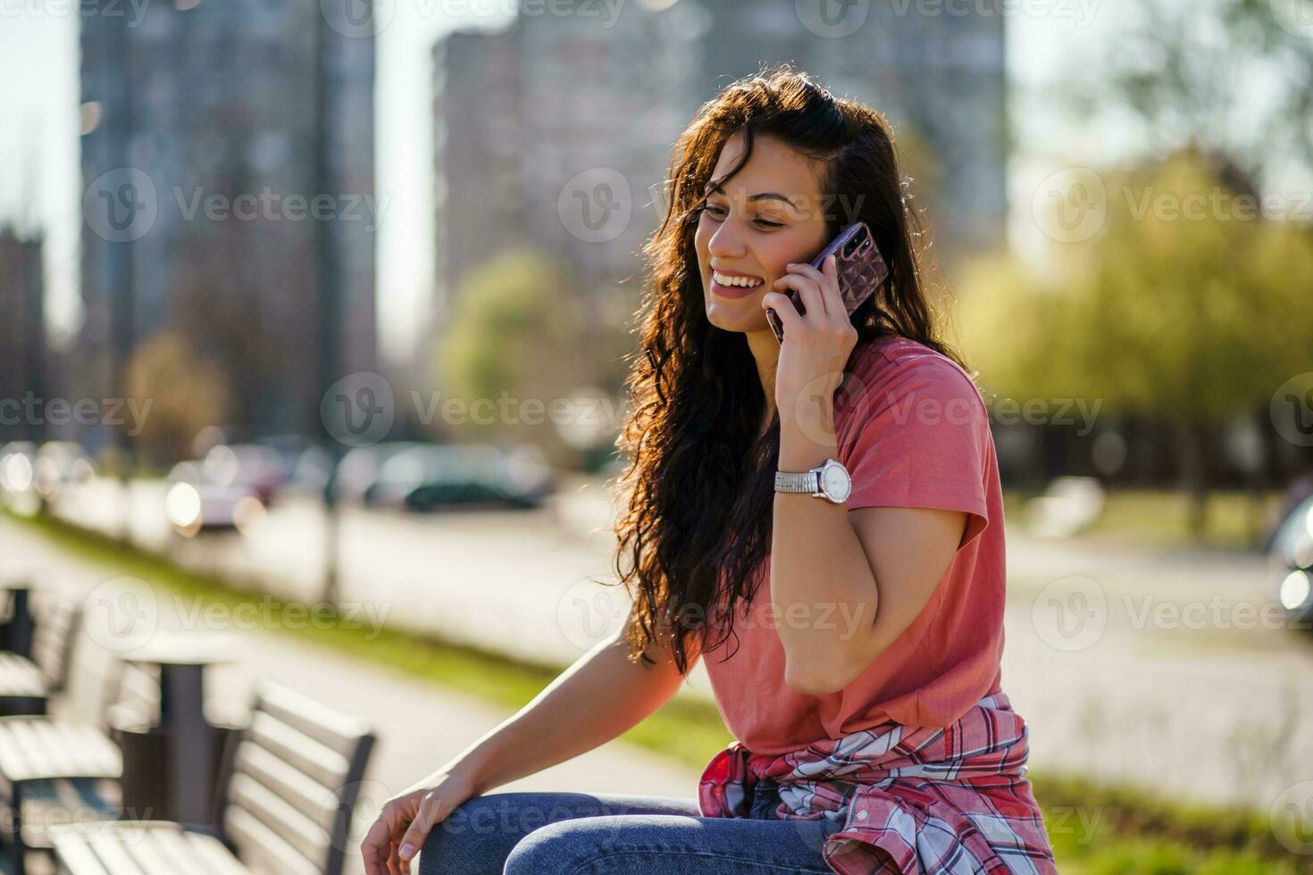A woman has a phone conversation photo