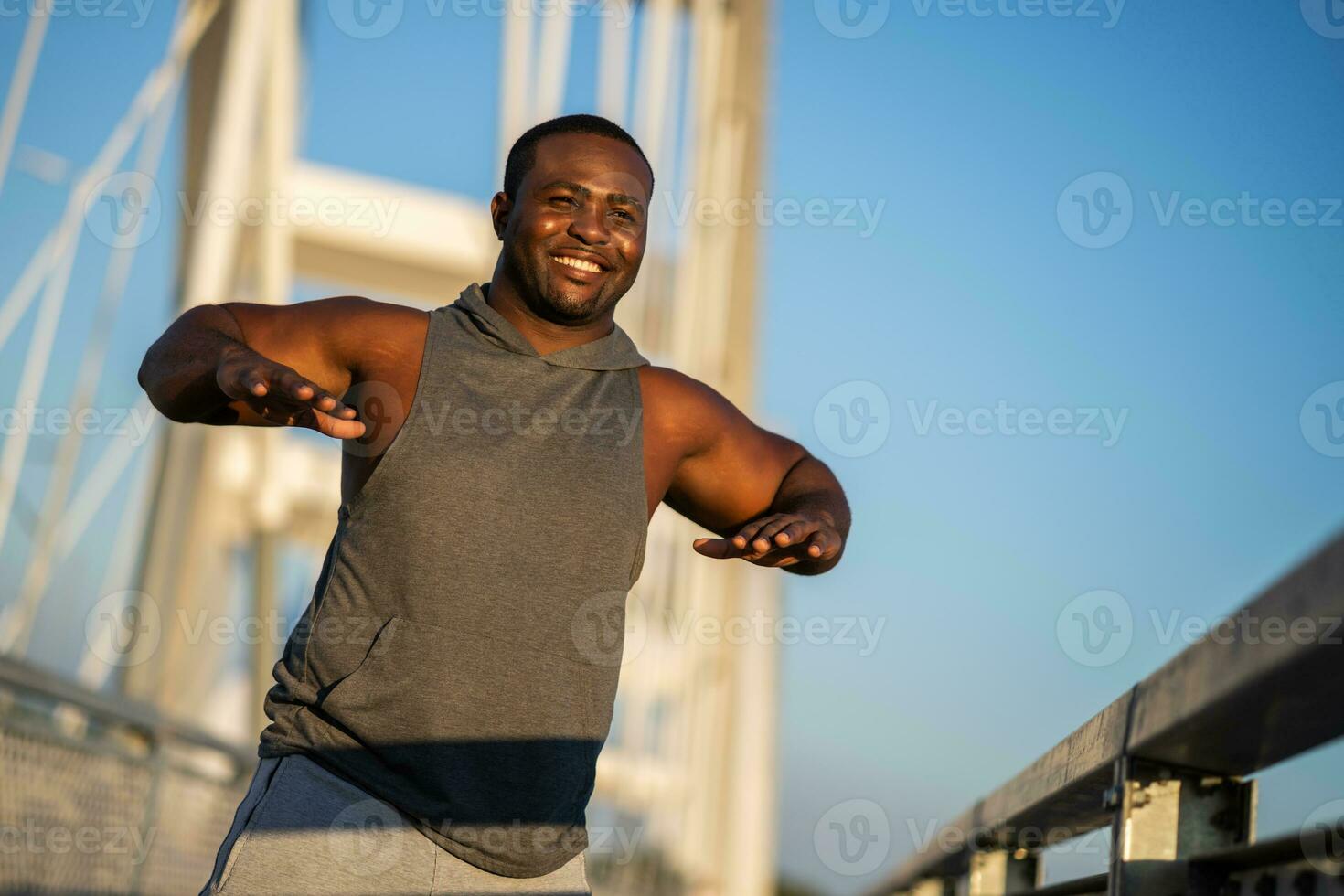 An African American man doing physical exercises photo