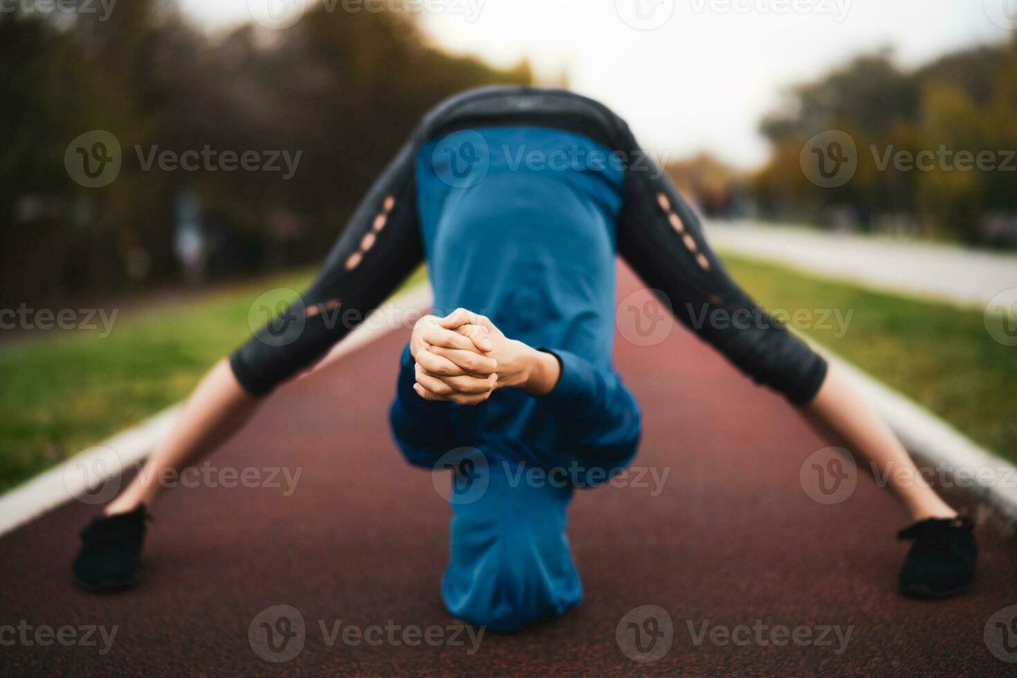 A young woman doing physical exercises photo