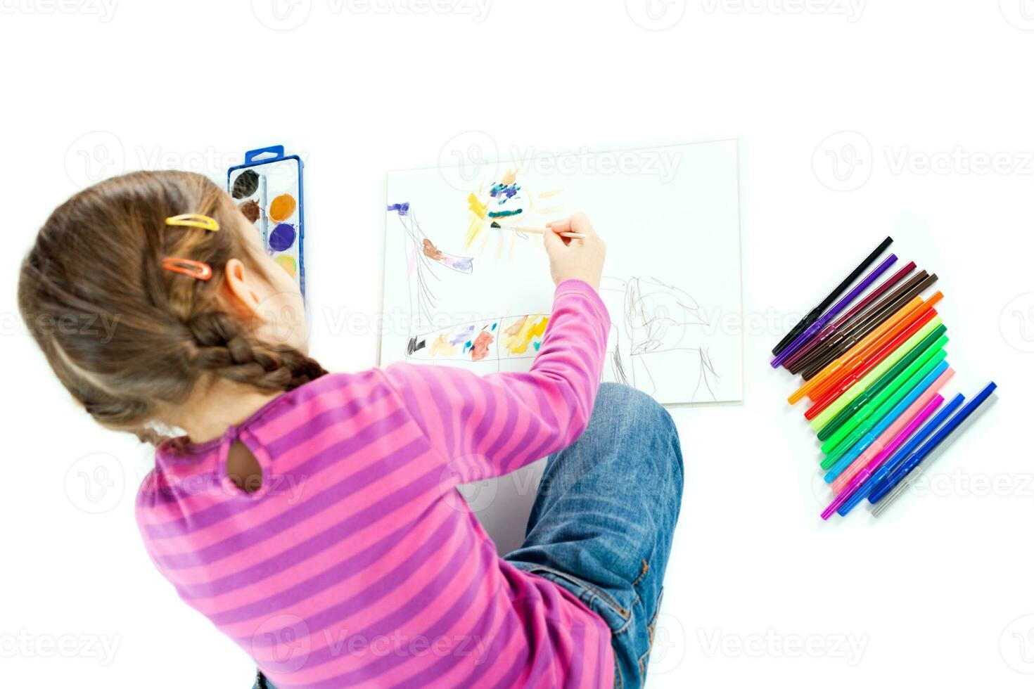 A little girl drawing photo