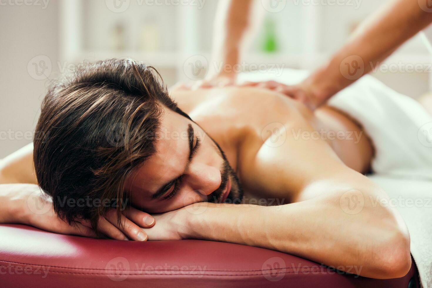 A man getting a back massage photo