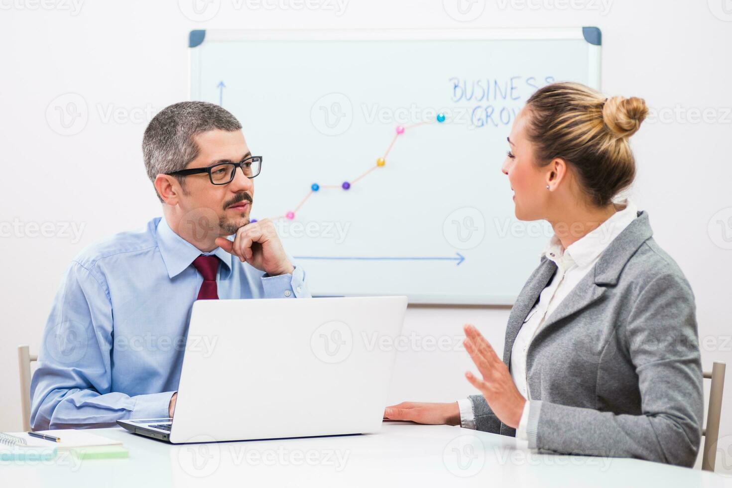 Business people discussing a business strategy photo