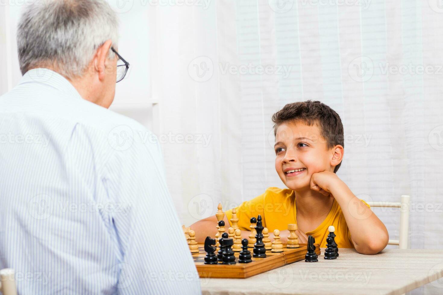 A grandfather spending time with his grandson photo