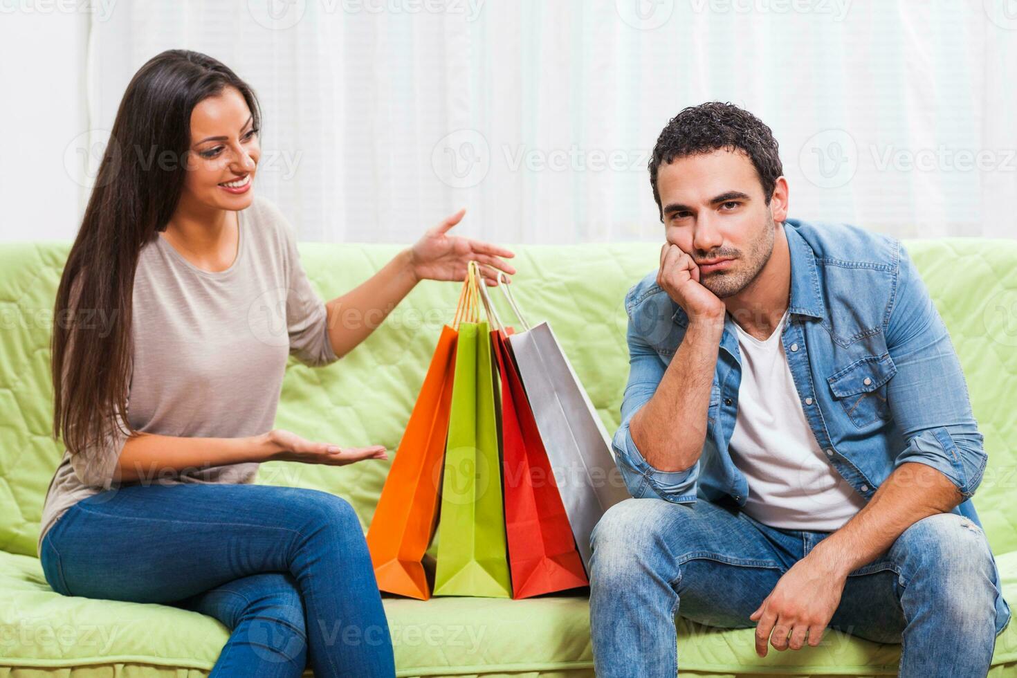 Portrait of a young couple arguing photo