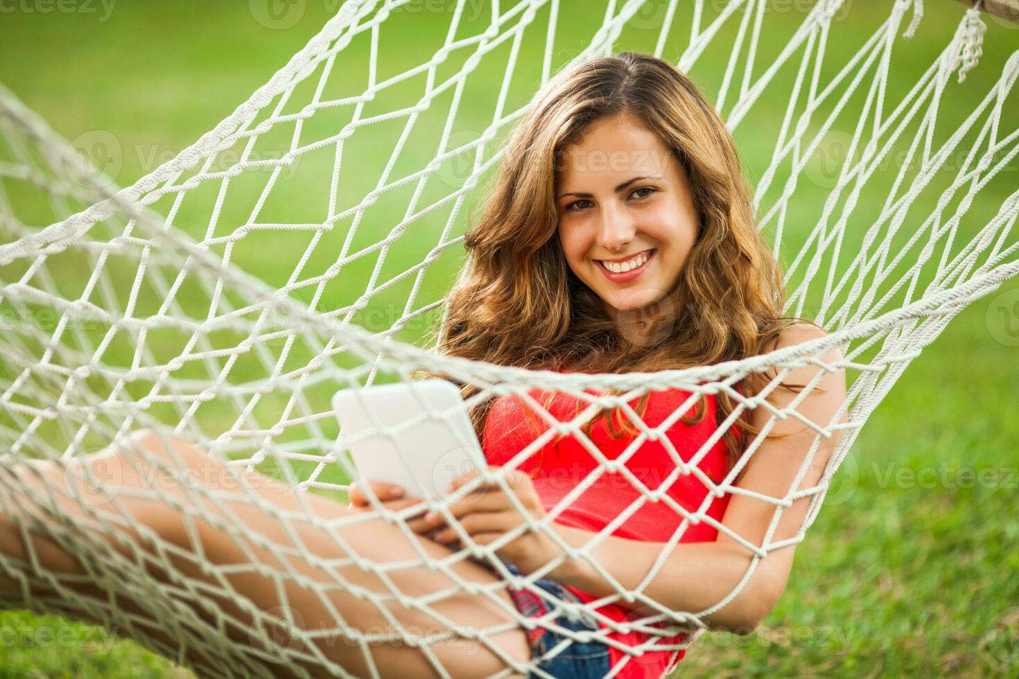 A young woman resting in a hammock photo