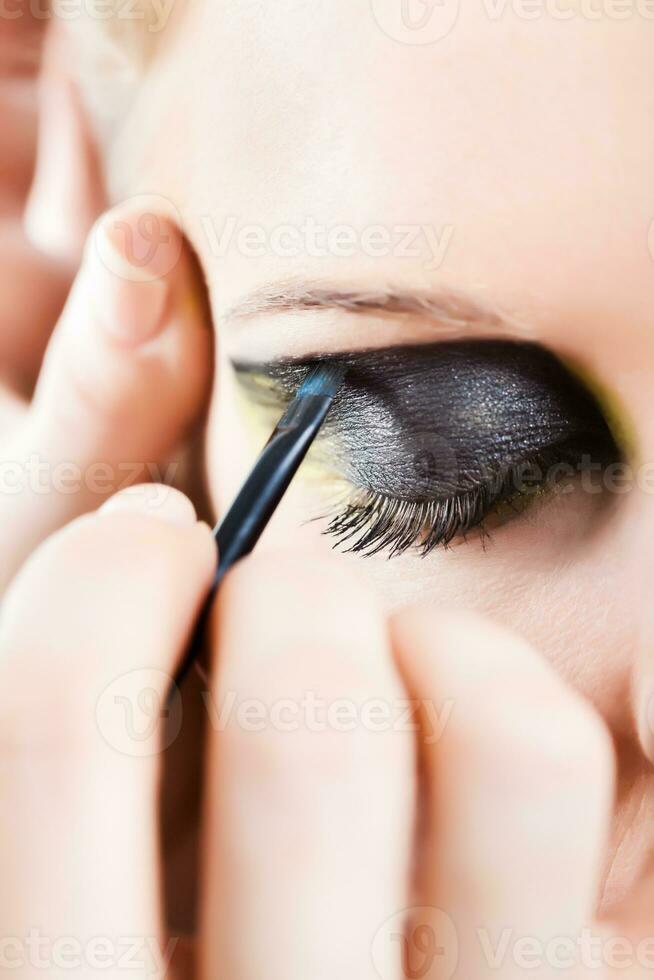 Portrait of young woman with fashion make-up photo