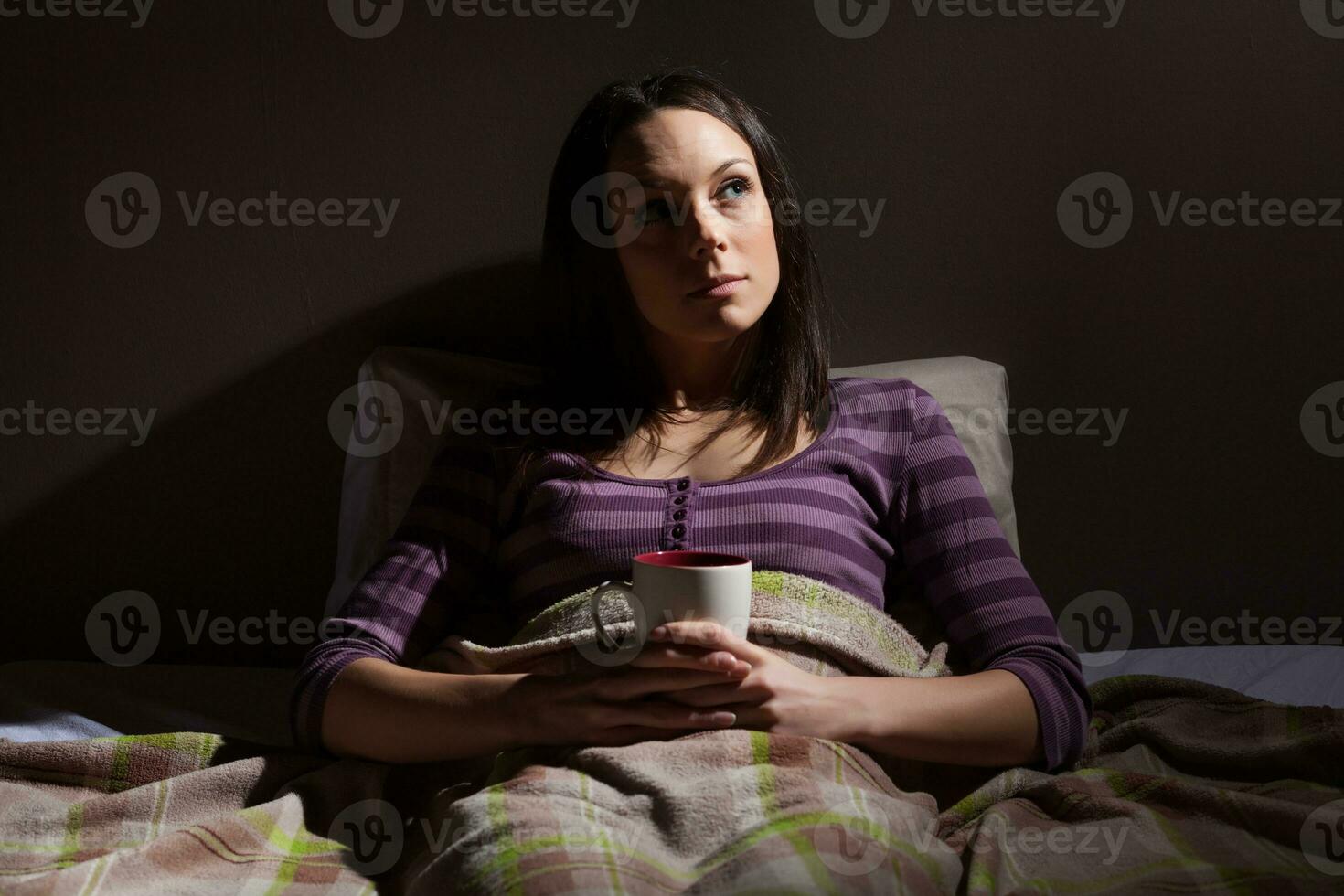 A young woman resting in the bed photo