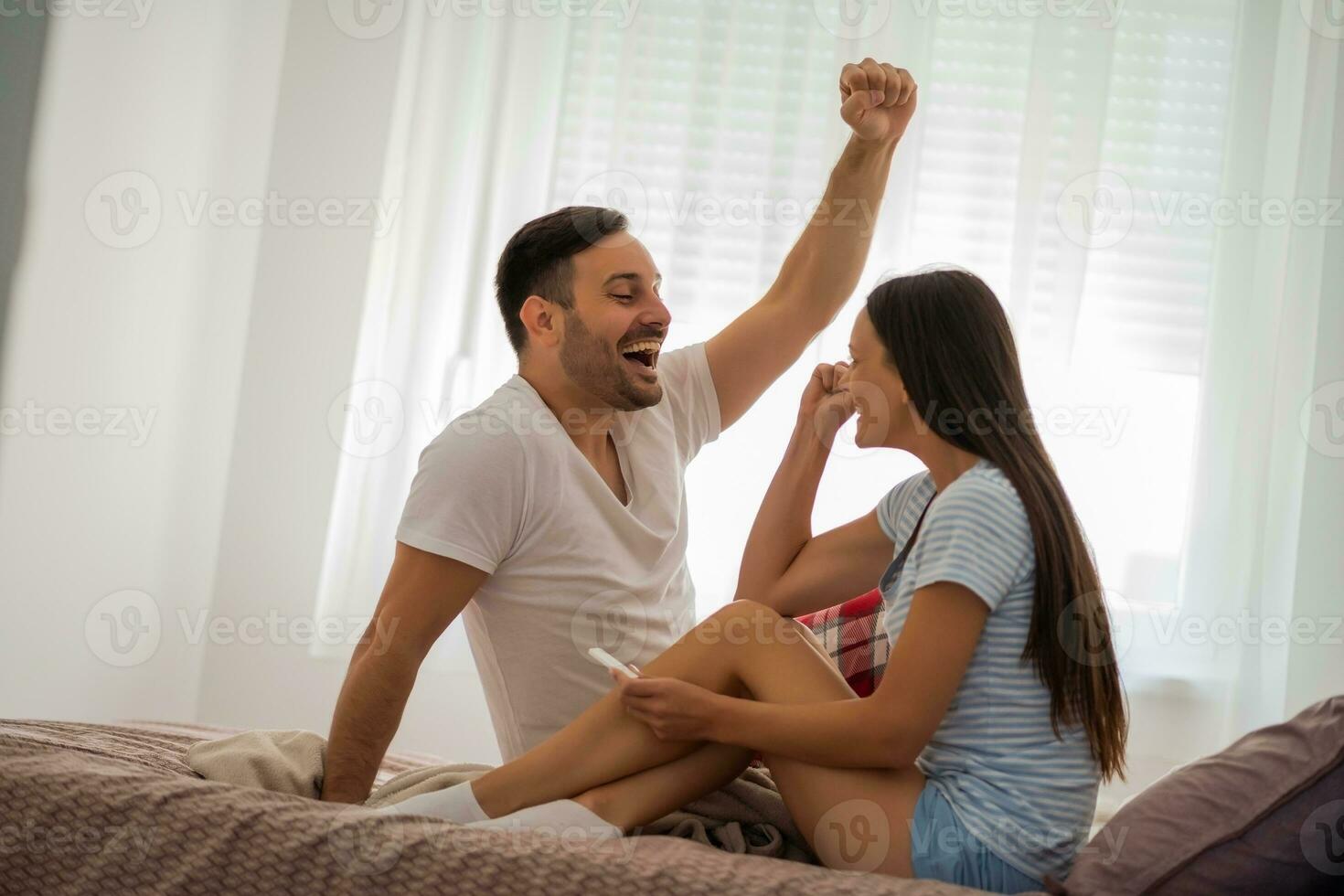 A couple finding out the result of a pregnancy test photo