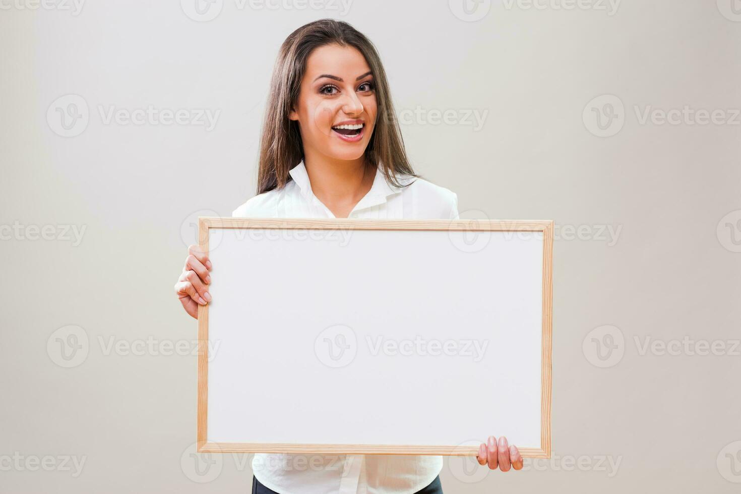 A woman with a blank board display photo