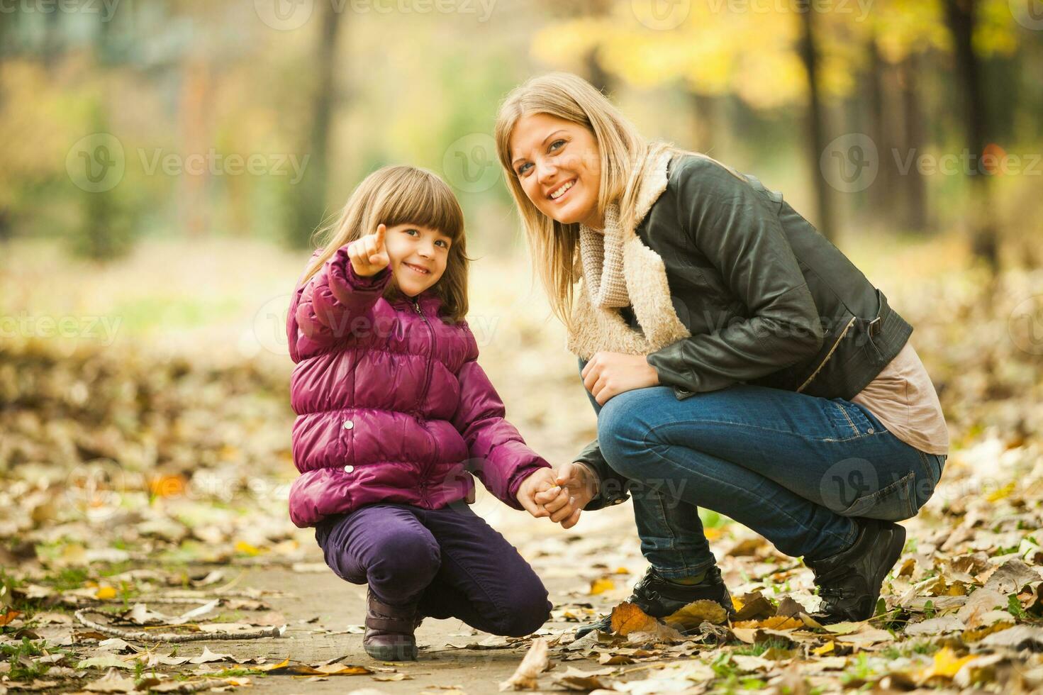 A mother with her daughter in the park photo