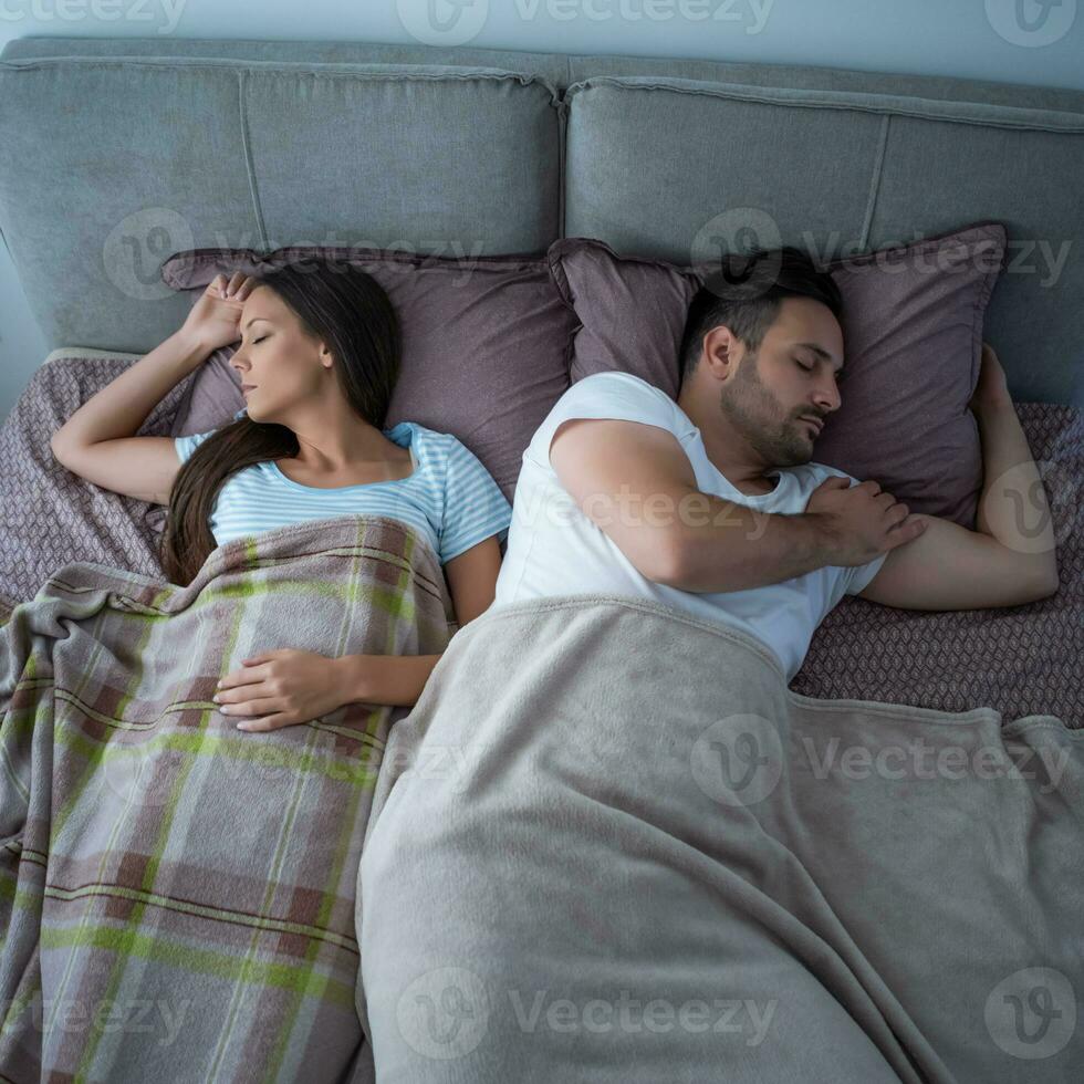 A young couple lying in bed photo