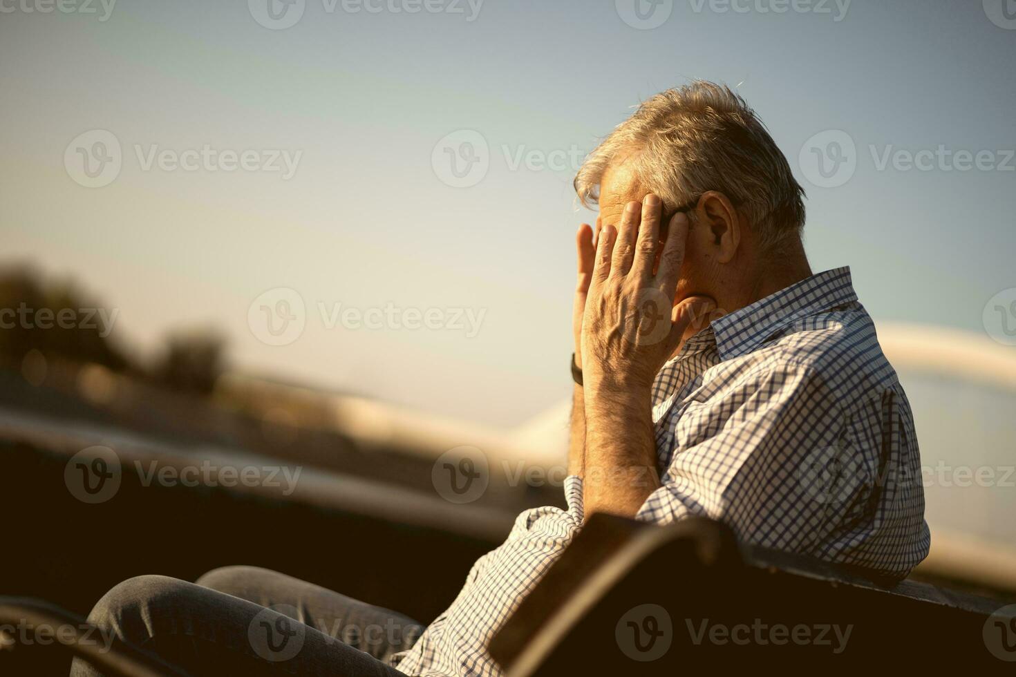 Upset senior man outside photo