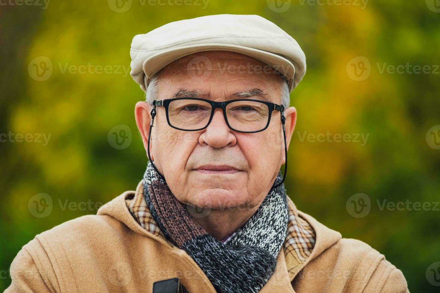 Outdoor portrait of a senior man in winter coat photo