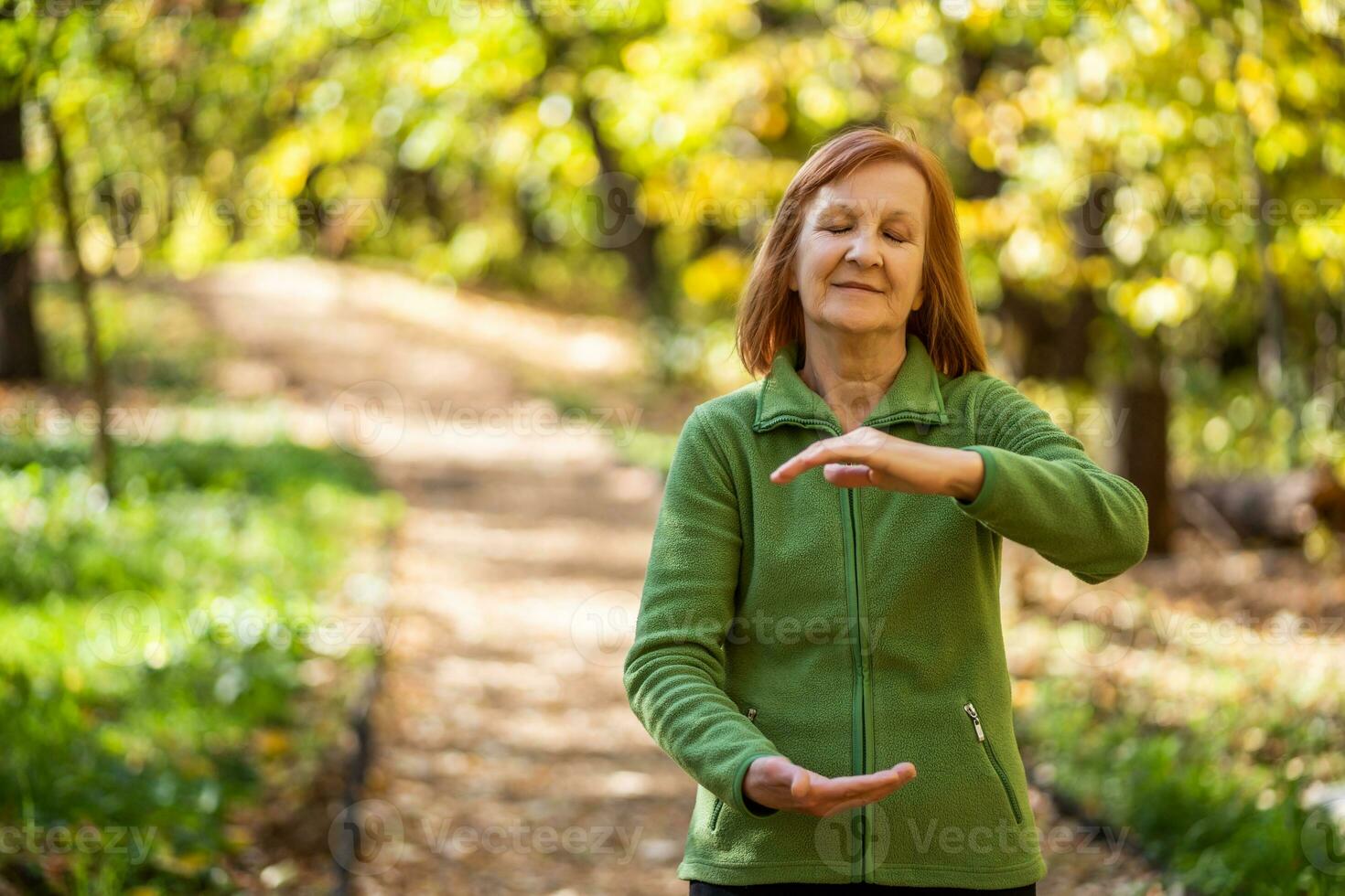 A senior woman doing physical exercises photo