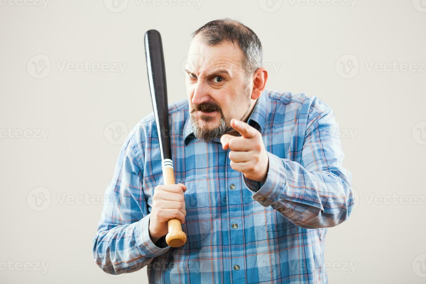 An angry man with baseball bat photo