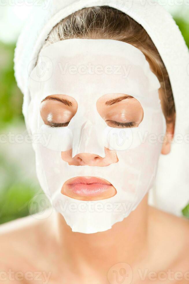 A woman with a face mask photo