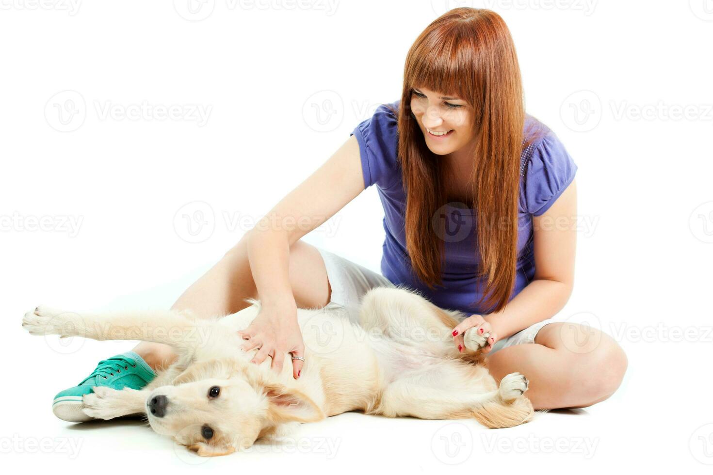 A woman grooming a dog photo