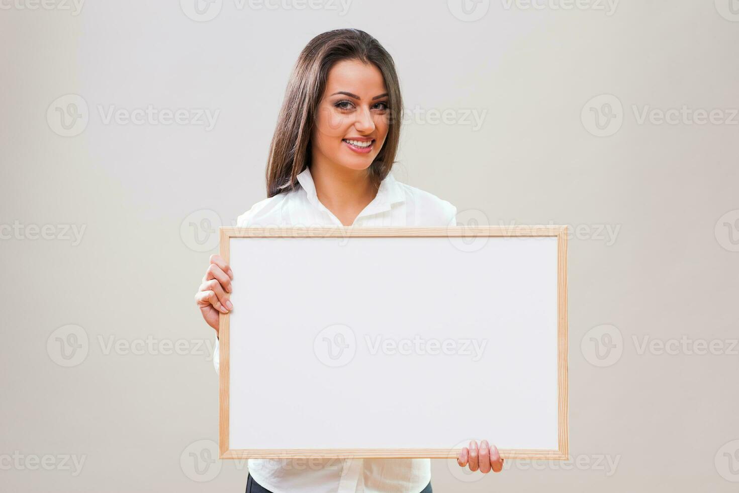 A woman with a blank board display photo