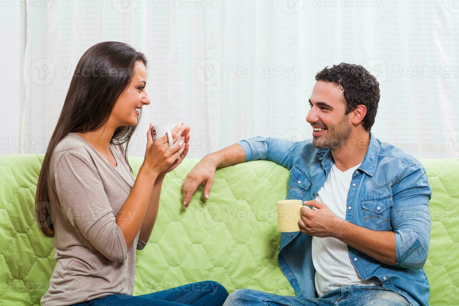 Portrait of a young couple drinking coffee photo