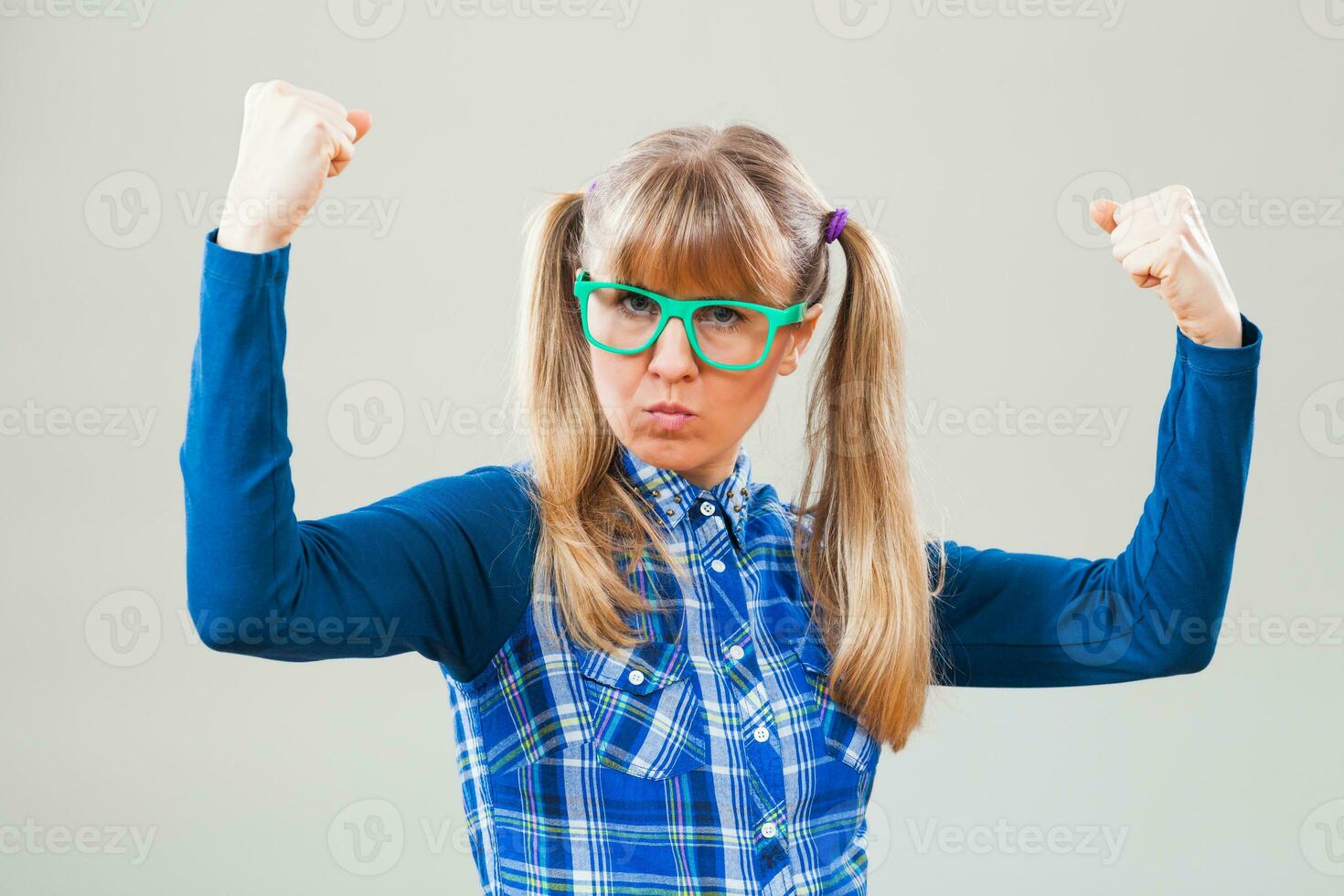 Portrait of a strong woman with green glasses photo