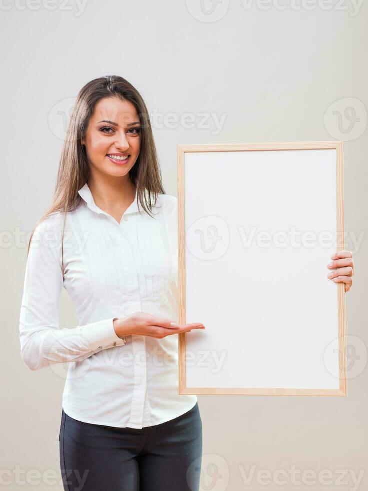 A woman with a blank board display photo