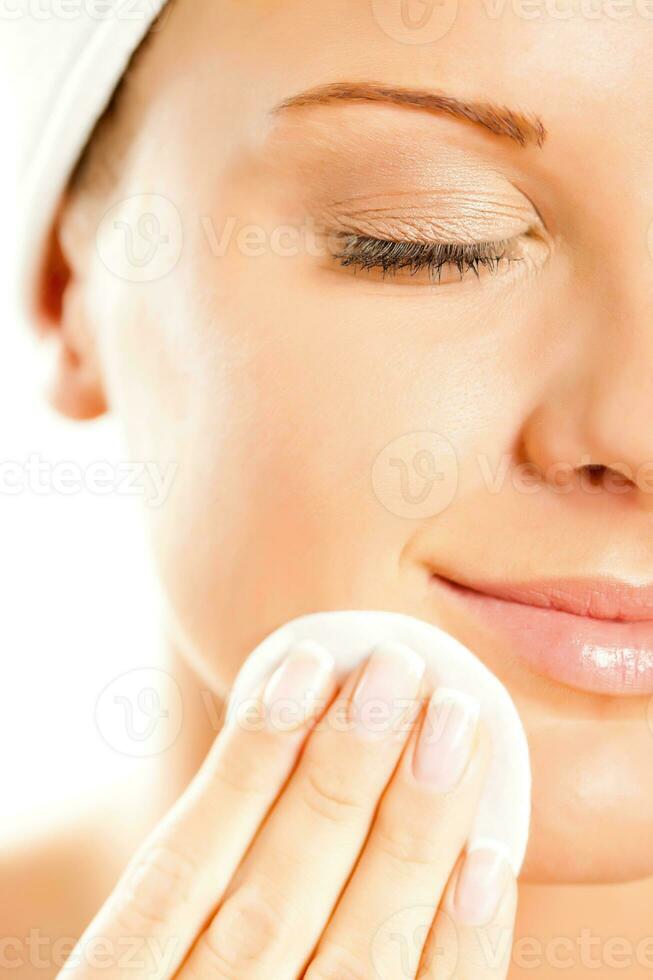 A woman taking care of her face photo