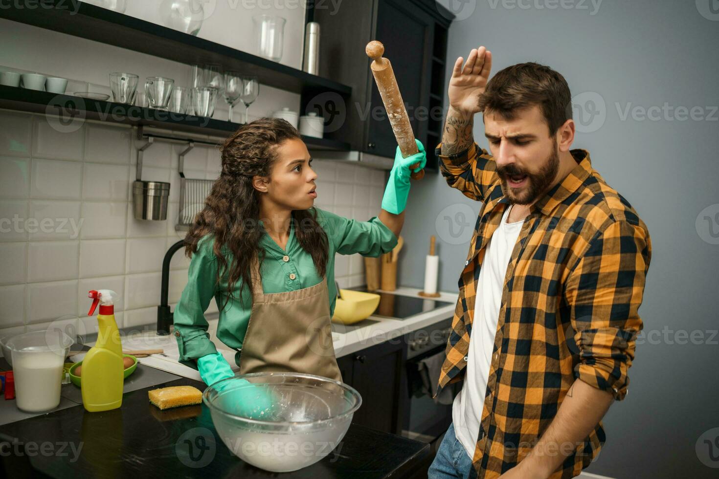 A couple cleaning the kitchen photo