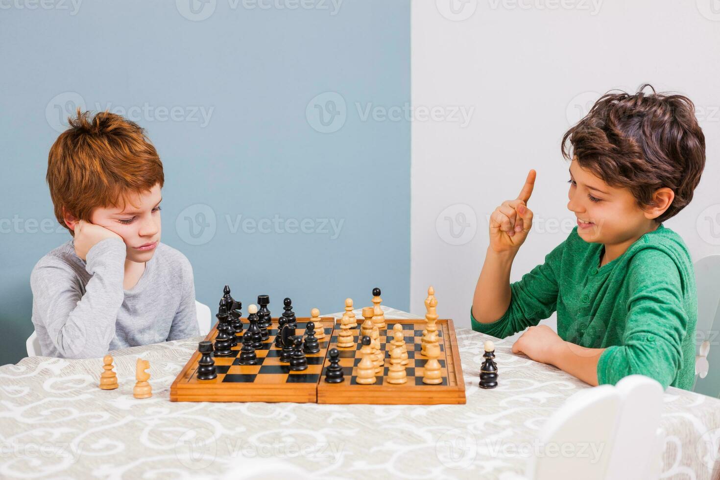 Kids playing chess photo