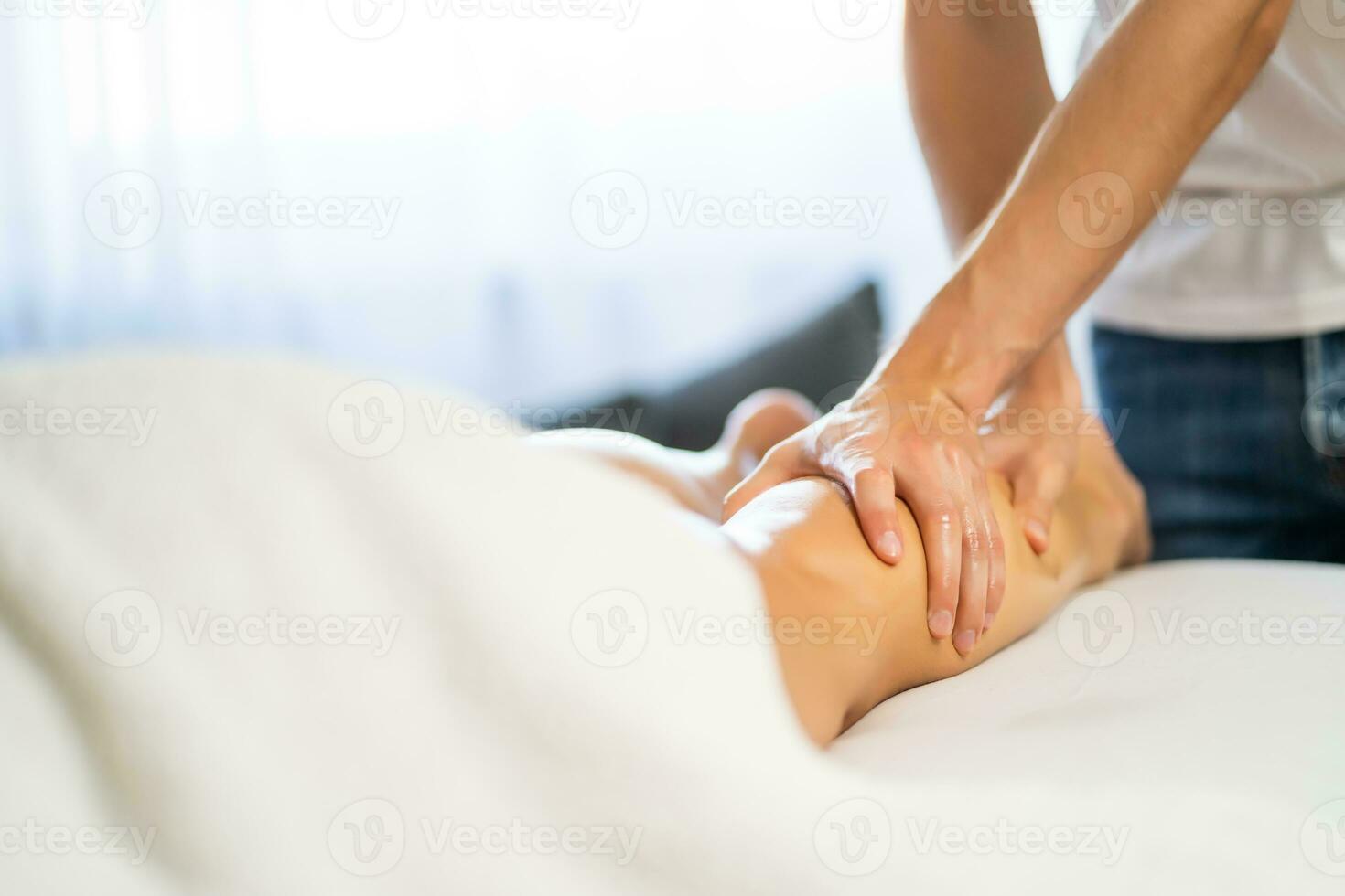 Woman enjoying a leg massage photo