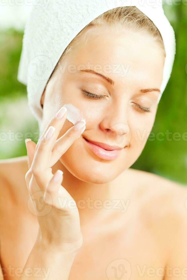 A woman taking care of her skin photo